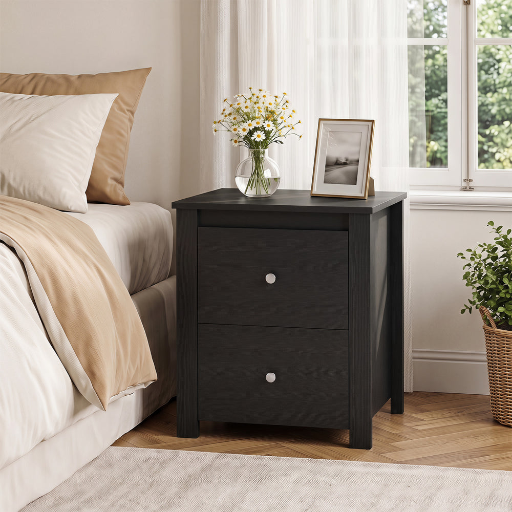 Black nightstand with two drawers, sturdy construction, and wide tabletop for bedroom or living room storage.