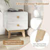 White nightstand with 2 drawers, solid rubber wood legs, and easy-grip knobs for stylish storage and display.