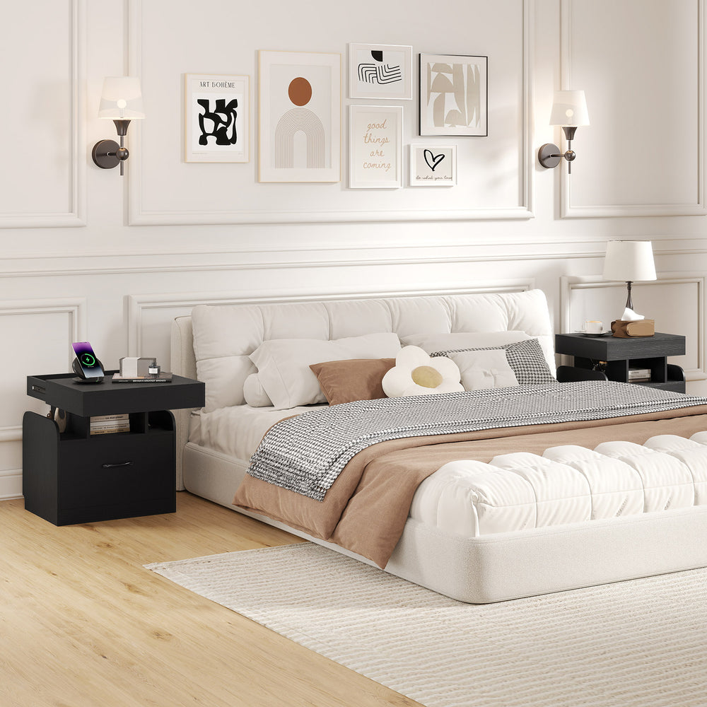 Modern black nightstand with charging station, sliding top storage, and three open compartments for organized bedside.