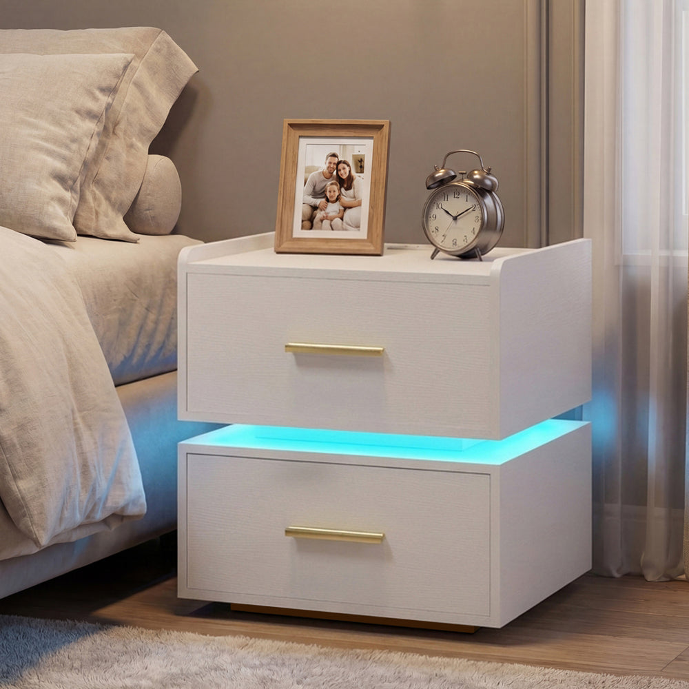 White nightstand with LED light strip, two storage drawers, and charging station for modern bedroom convenience.