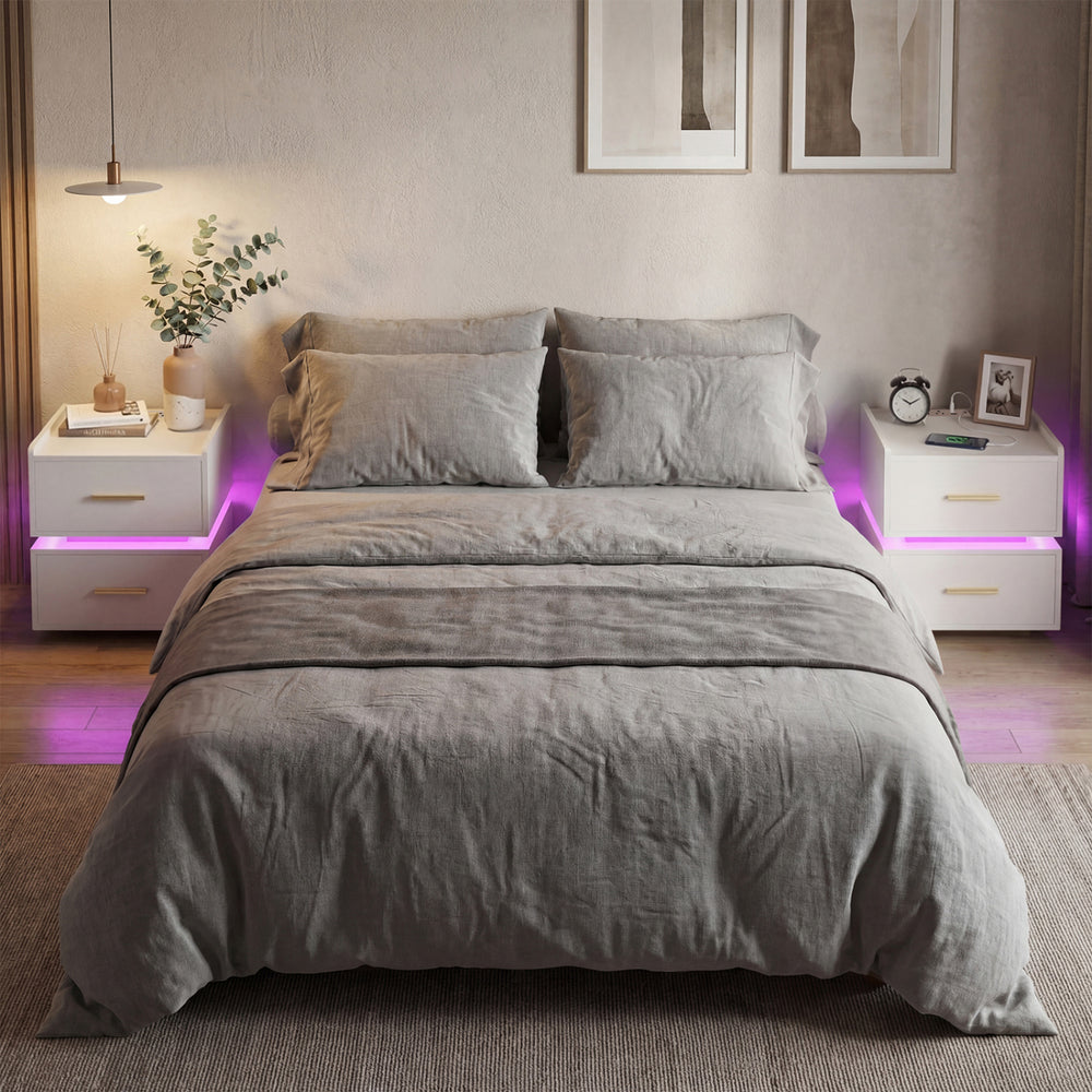 White nightstand with LED light strip, two storage drawers, and charging station, ideal for modern bedroom decor.