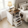 Nightstand with rustic brown finish features a charging station, two drawers, and metal mesh front for stylish bedroom storage.