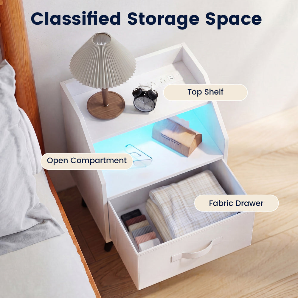 Nightstand with LED lights features an open storage shelf, fabric drawer, and built-in charging station for convenience.