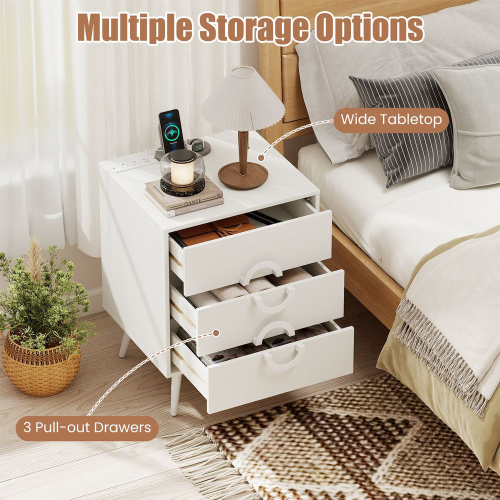 Modern white nightstand featuring a wide tabletop, three pull-out drawers, and convenient power outlets for bedside use.