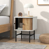 Mid-century modern nightstand with sliding doors, white finish, and metal legs for compact bedroom storage.
