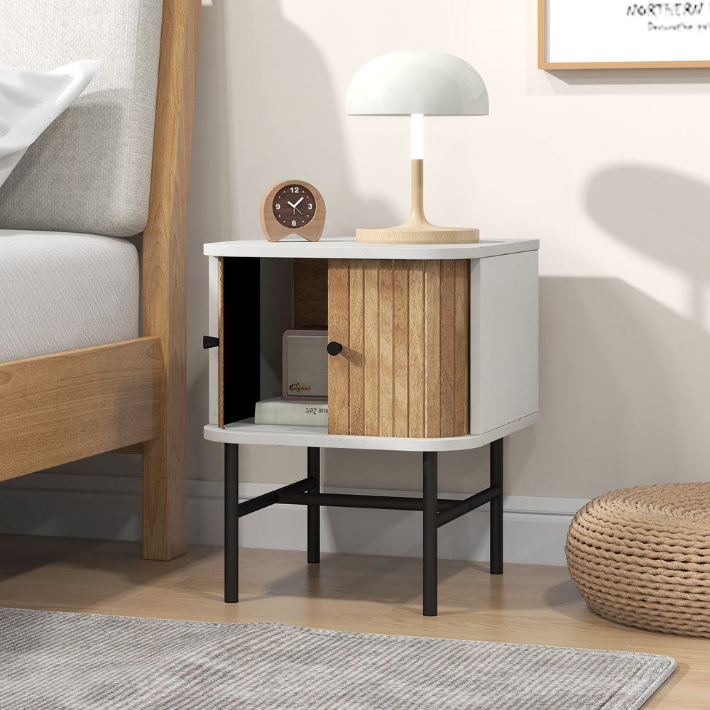 Mid-century modern nightstand with sliding doors, white finish, and metal legs for compact bedroom storage.