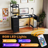 Office desk with RGB LED lights, open shelves, and power outlets in black, perfect for home office organization.