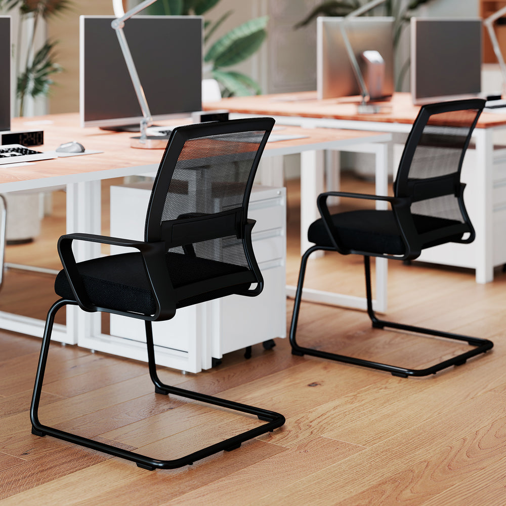 Office guest chairs with breathable mesh backs and lumbar support, ideal for home offices or waiting rooms.