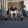 Olympic Hex Trap Bar with foldable handles, featuring knurled grips and spring collars for secure weight lifting.
