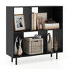 Open shelf bookcase in black with 4 compartments, featuring decorative items and sturdy metal legs for stability.