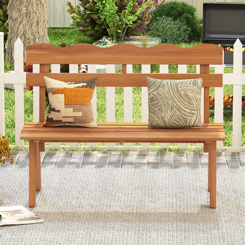Outdoor acacia wood garden bench with ergonomic backrest, featuring two decorative pillows, perfect for patio.