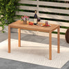 Acacia wood dining table with a slatted top, featuring rounded corners, ideal for outdoor dining on a balcony or deck.
