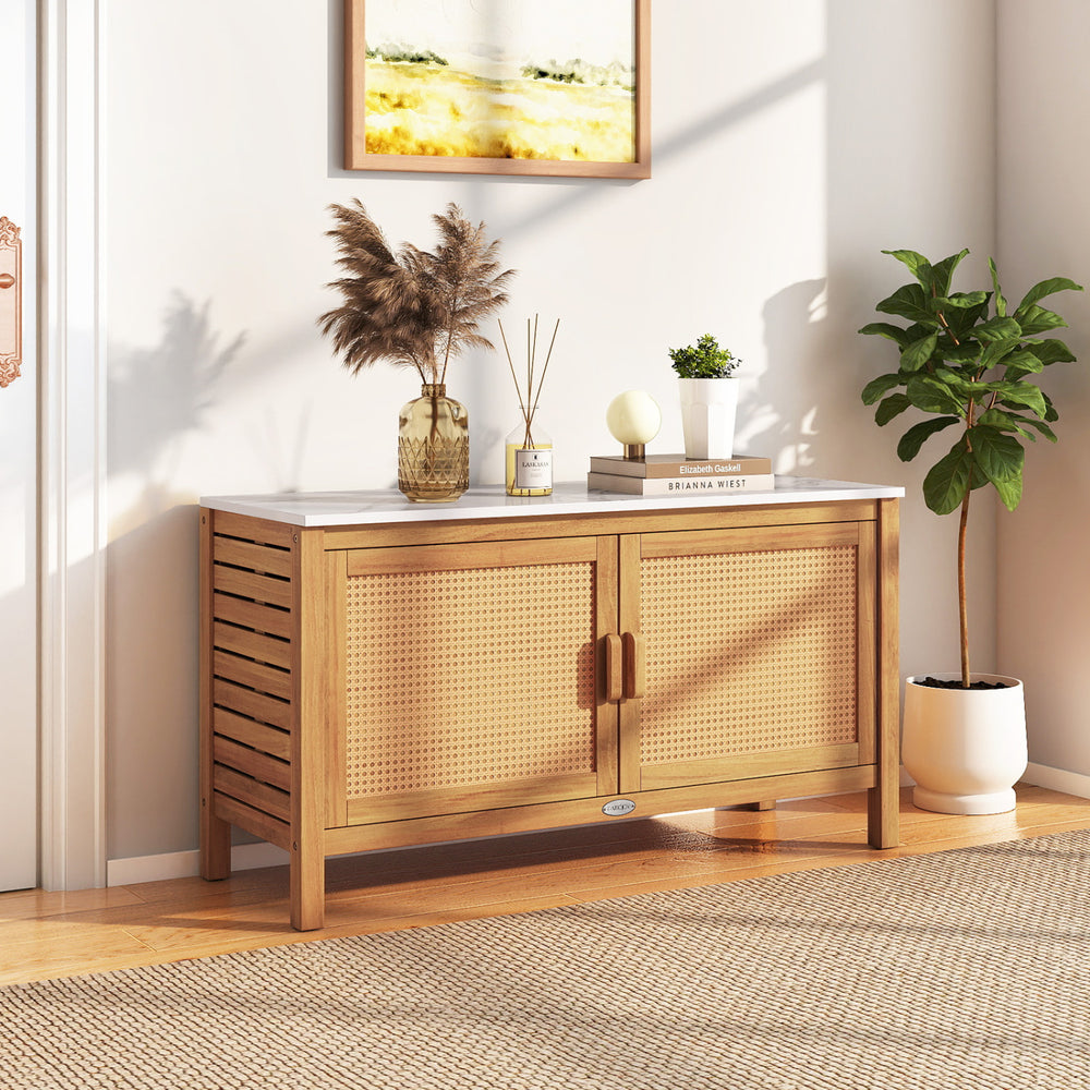 Acacia wood storage cabinet with faux marble top, featuring rattan doors and spacious shelves for versatile.
