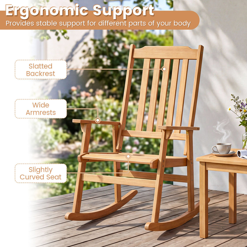 Outdoor acacia wood rocking chair with slatted backrest and wide armrests, perfect for patio relaxation.
