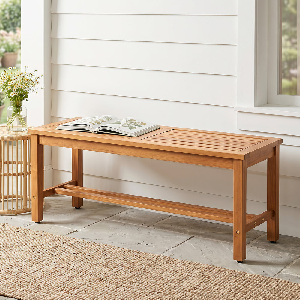 Acacia wood patio bench for 2 features a slatted seat, sturdy design, and adjustable foot pads for stability.