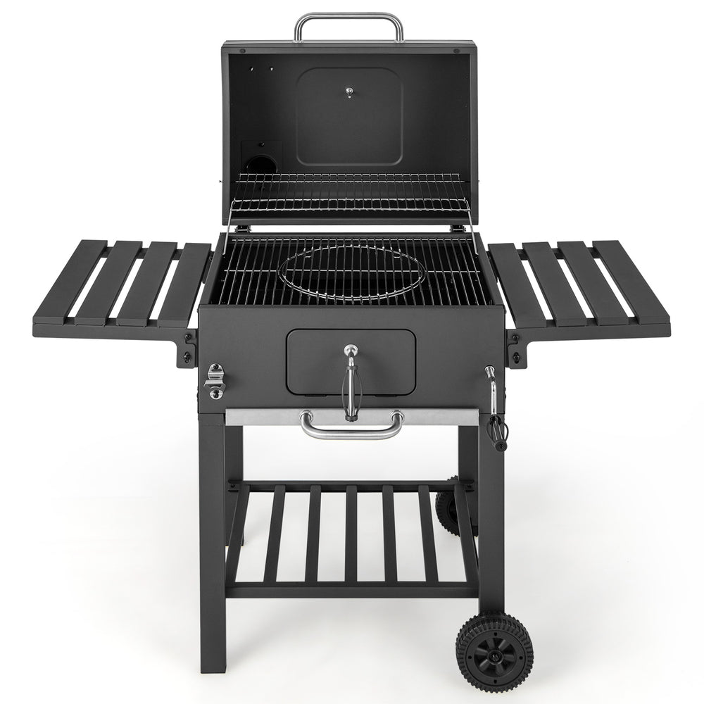 Outdoor BBQ charcoal grill with foldable side tables, wheels, and a built-in temperature gauge for easy grilling.