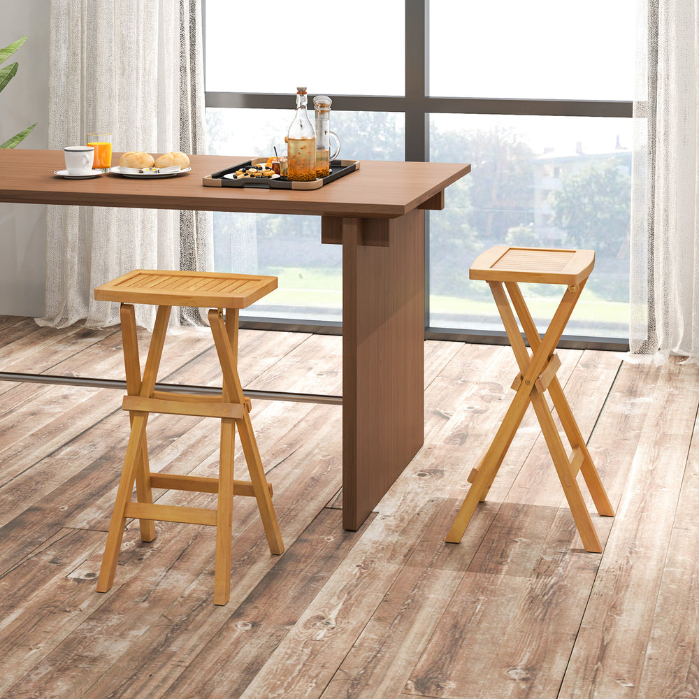 Set of 2 folding outdoor bar stools with ergonomic teak wood seats and stable x-shaped frames for easy storage.