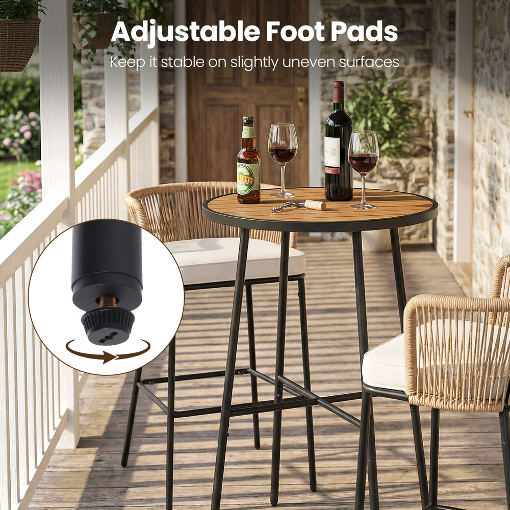 Adjustable foot pads on the 41" outdoor bar table with acacia wood top and metal frame for stability on uneven surfaces.
