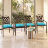 Set of four turquoise outdoor chair cushions made of waterproof olefin fabric, designed for comfort and style.