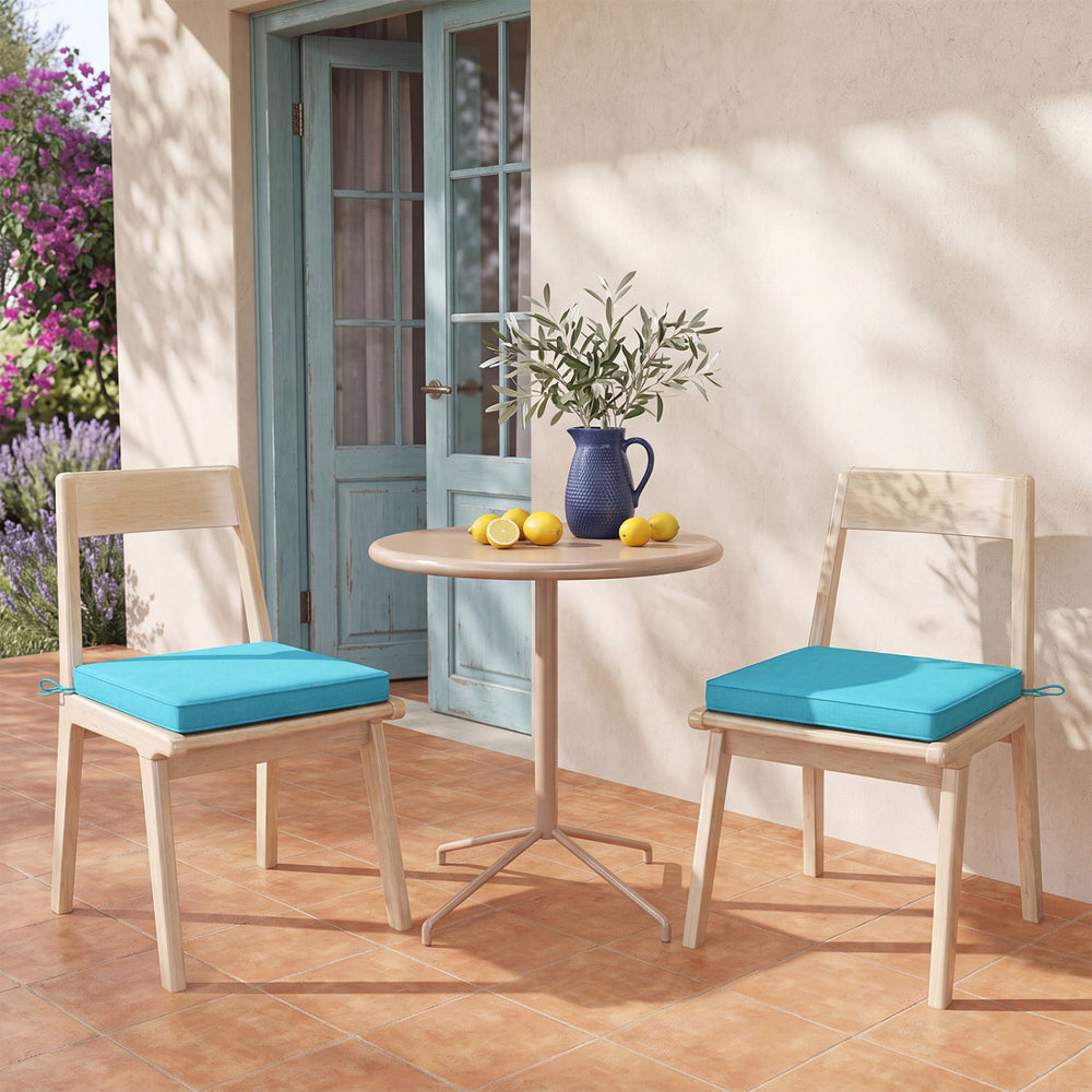 Turquoise outdoor chair cushion set of 4, made of waterproof olefin fabric, adds comfort and style to your furniture.
