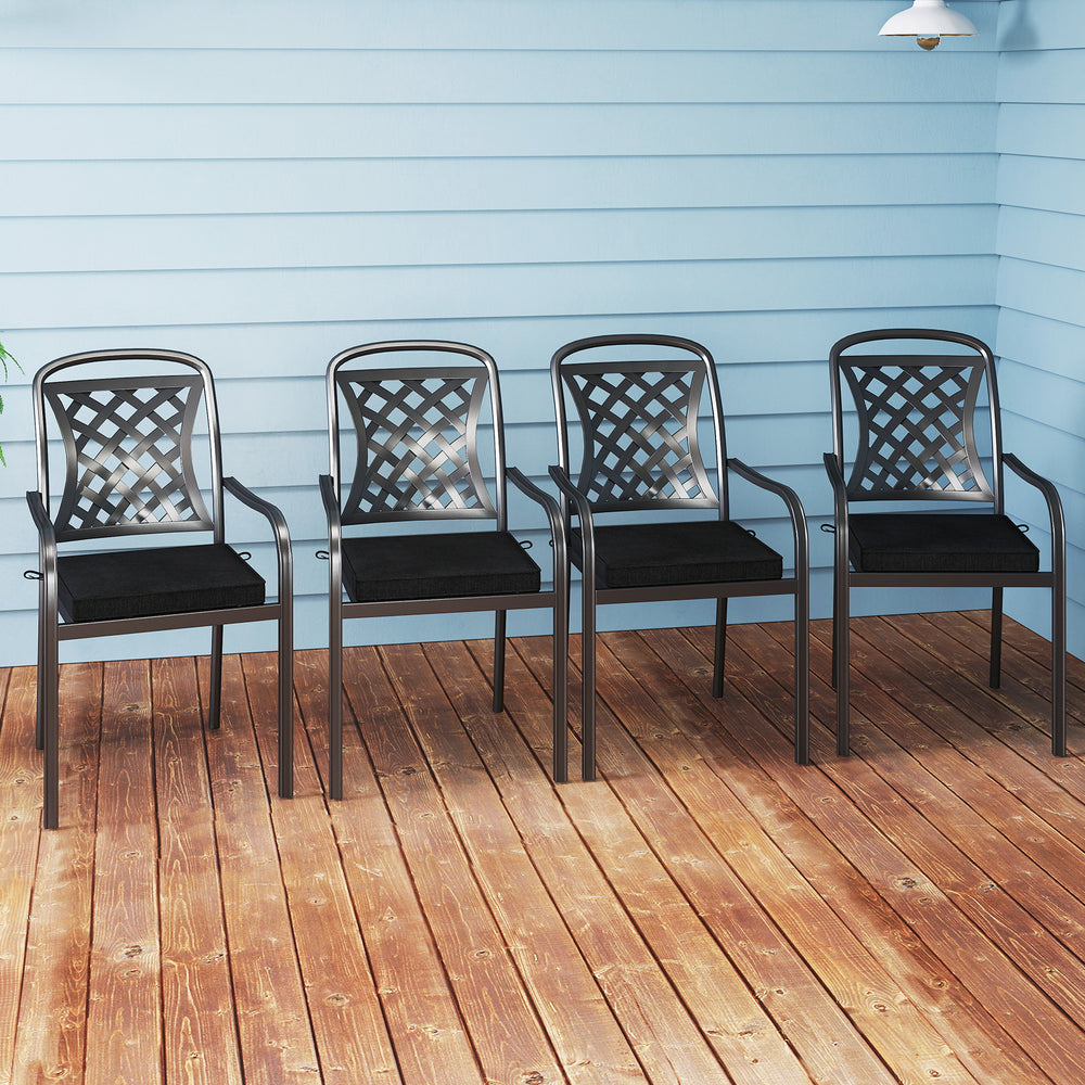 Set of four outdoor chairs with black waterproof cushions, featuring breathable olefin fabric for comfort and style.