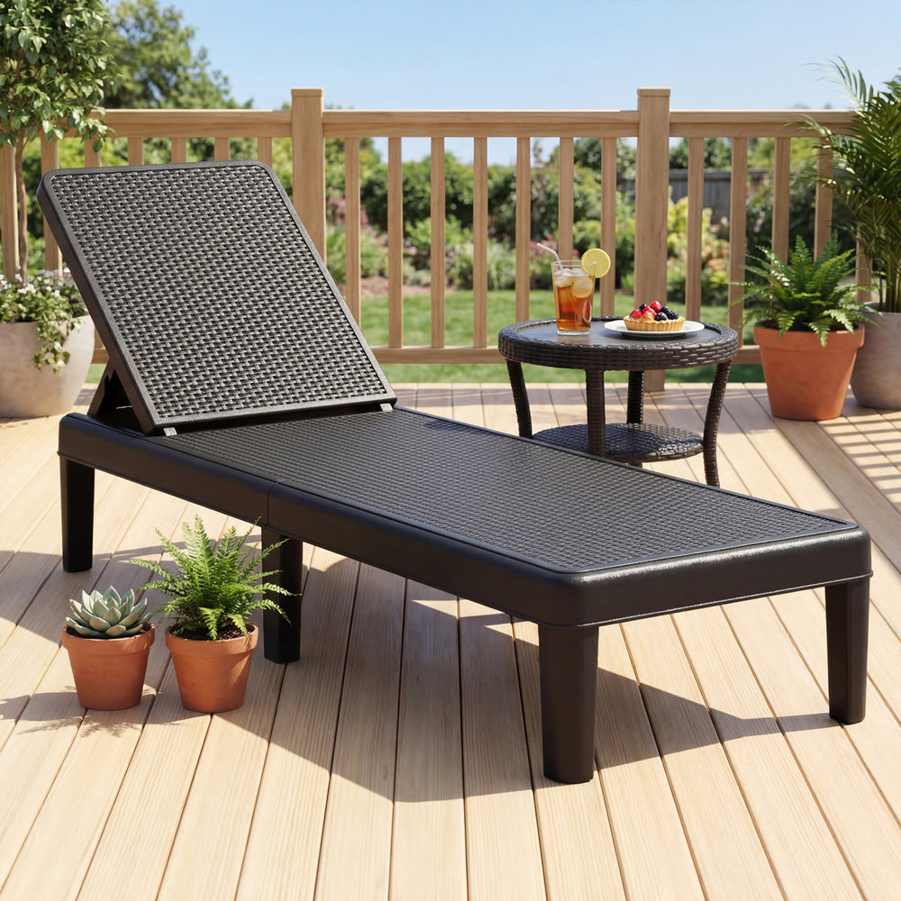 Black outdoor chaise lounger chair with waterproof rattan textured surface, adjustable backrest for sunbathing or.