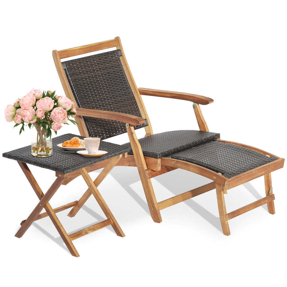 Folding lounge chair with retractable ottoman and acacia wood table in brown PE wicker, perfect for patio relaxation.