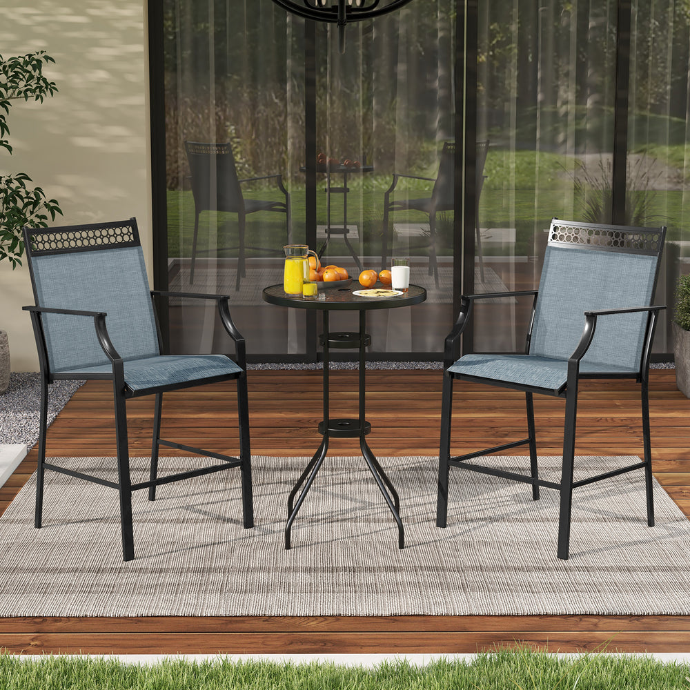 Two blue outdoor counter stools with armrests and footrest, set beside a small table on a patio for casual dining.
