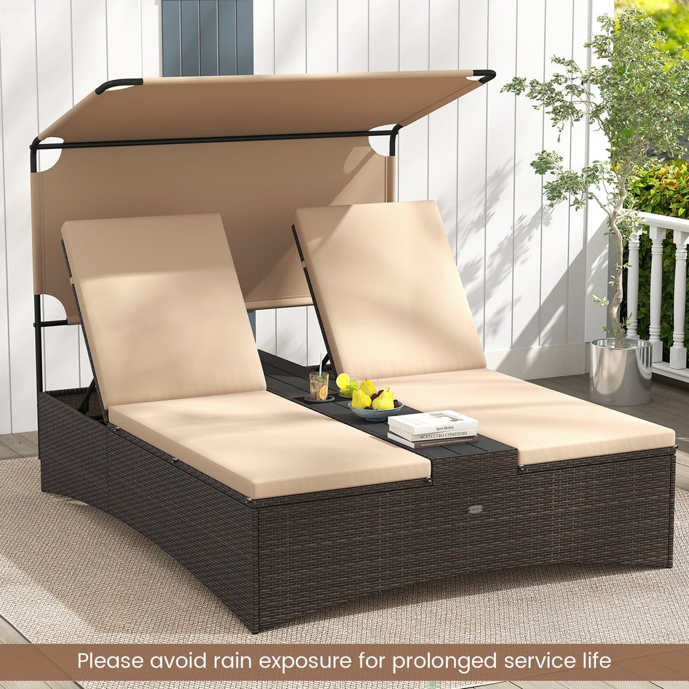 Outdoor daybed with adjustable backrests in brown PE rattan, featuring a sun-protective canopy for patio relaxation.