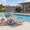 Gray outdoor dual rocker sunbed with large canopy and ergonomic design, ideal for relaxing by the pool or in the.