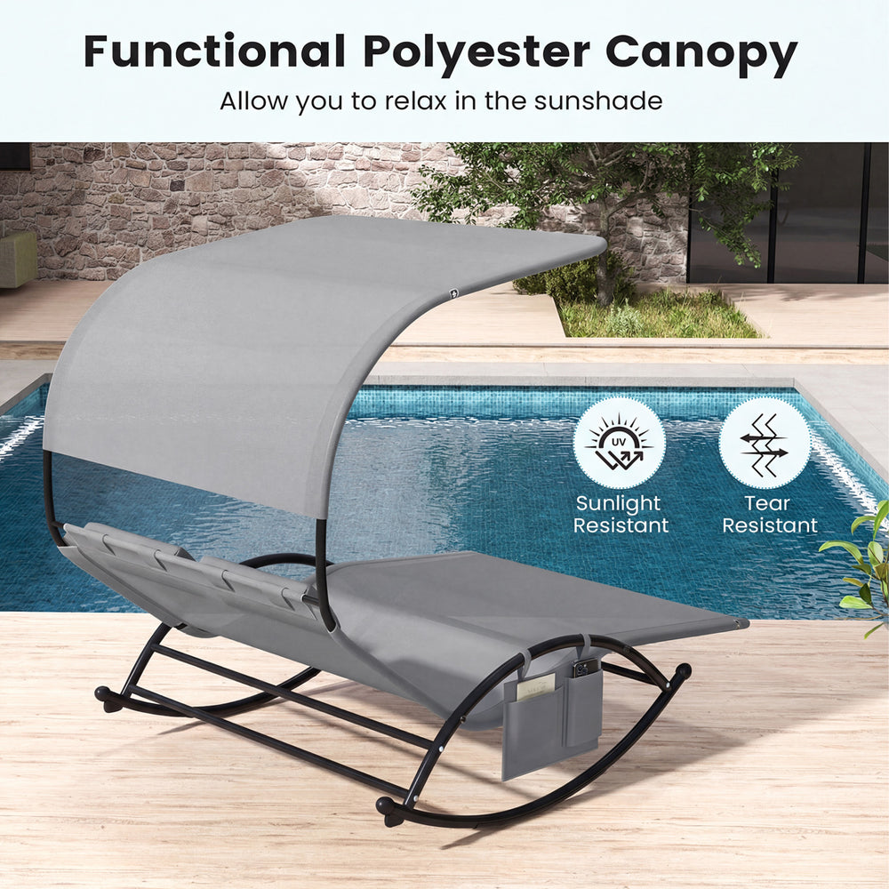 Outdoor dual rocker sunbed with gray polyester canopy, perfect for two-person relaxation by the poolside.