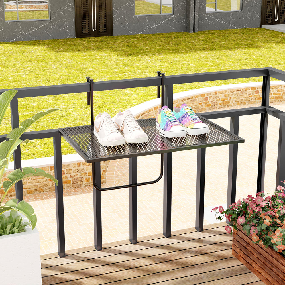 Outdoor folding hanging table with a black metal frame, ideal for saving space on balconies while enjoying drinks.