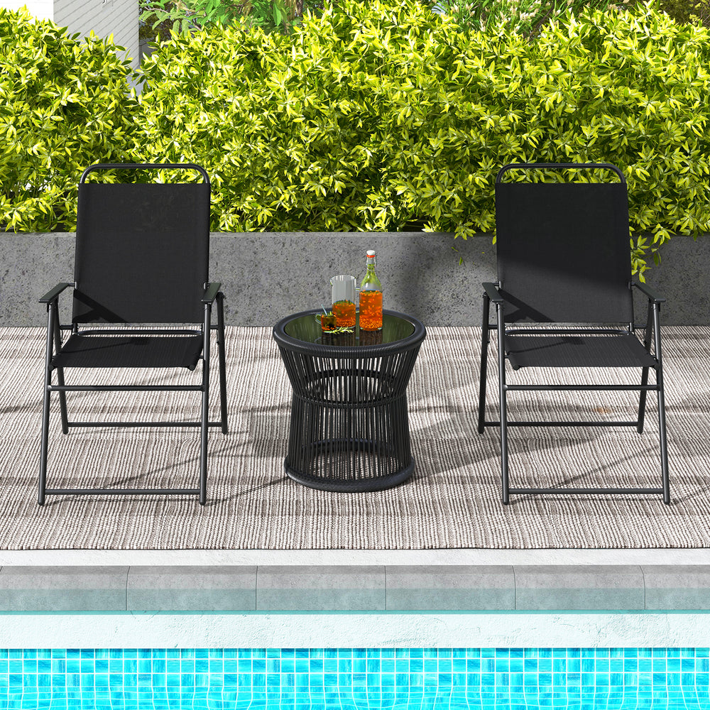 Black outdoor folding sling chairs set of 4 with armrests beside a pool, ideal for comfortable outdoor relaxation.