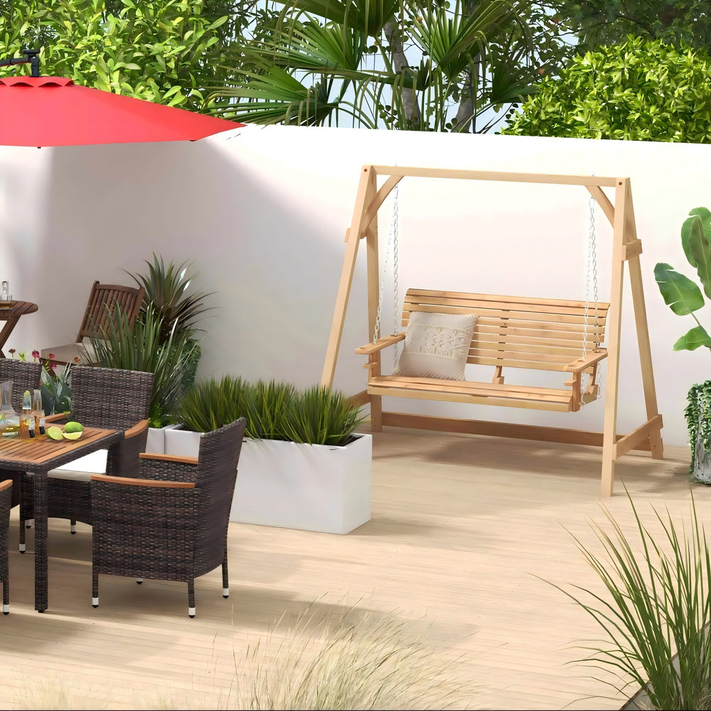 Acacia wood patio swing with adjustable design, surrounded by greenery, perfect for outdoor relaxation.
