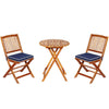 Bistro set featuring two stackable acacia wood chairs with cushions and a round folding table, perfect for outdoor.