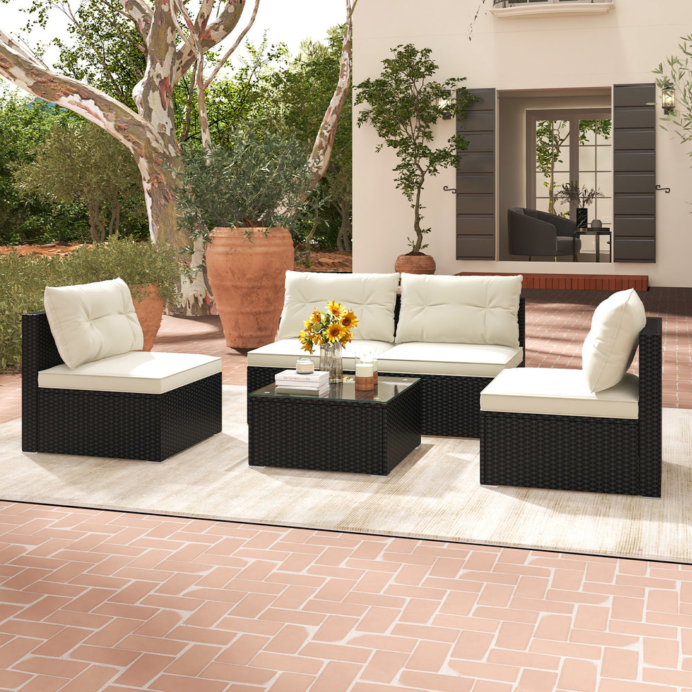 5-piece outdoor patio furniture set featuring black PE wicker, soft cushions, and a coffee table for garden relaxation.