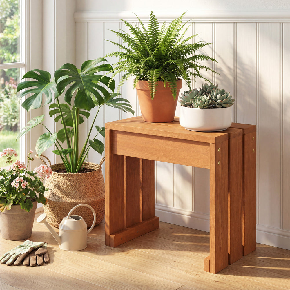 Backless outdoor garden bench in natural wood, ideal as a plant stand or side table for compact spaces.