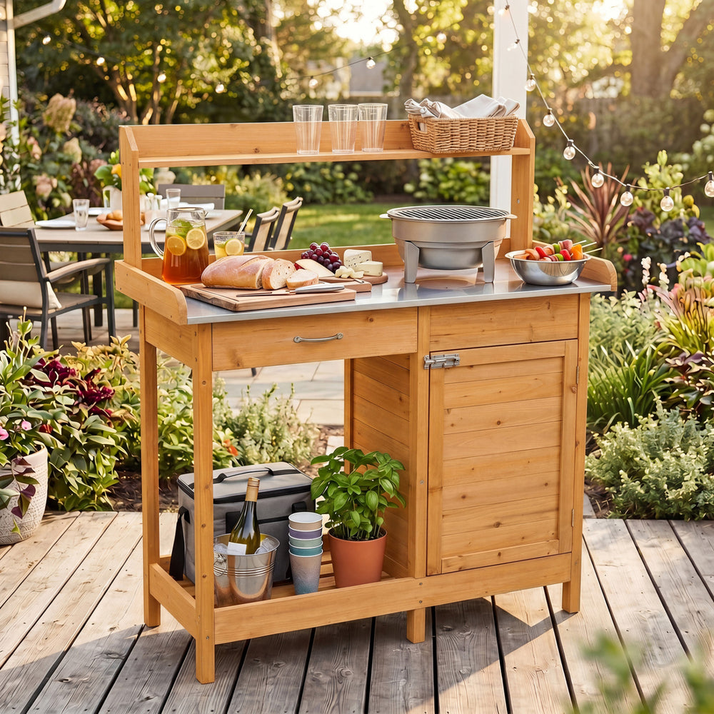 Outdoor garden wooden work station potting bench with a large metal tabletop and ample storage for gardening tasks.