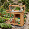 Outdoor garden wooden work station potting bench with a metal tabletop, large drawer, and removable lower shelf for gardening tasks.