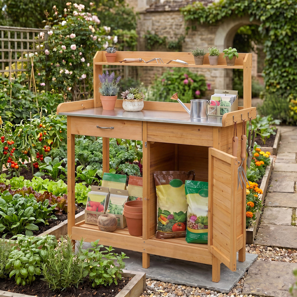 Outdoor garden wooden work station potting bench with a metal tabletop, large drawer, and removable lower shelf for gardening tasks.