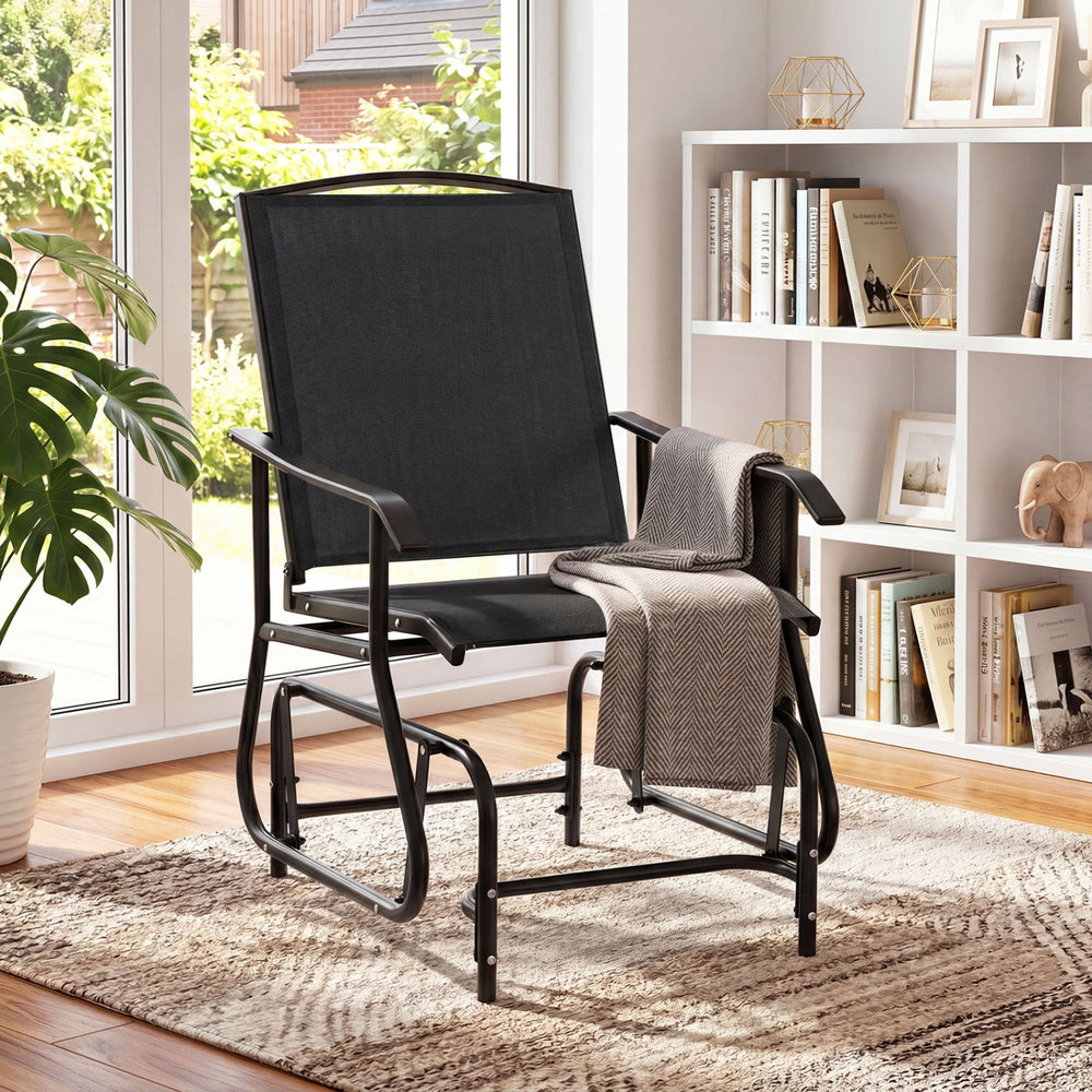 Black Tangkula outdoor glider chair with metal frame and armrests, perfect for relaxing on the patio or poolside.