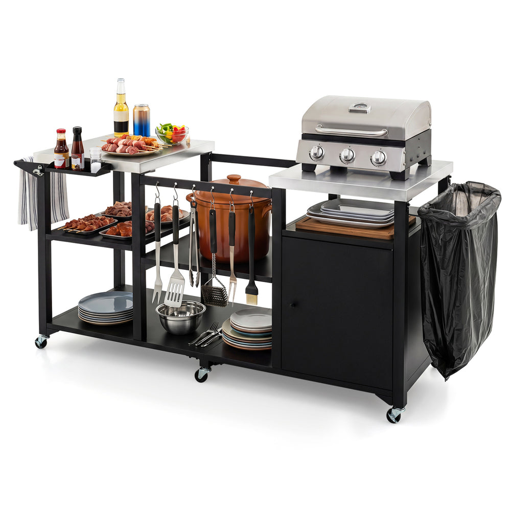 Outdoor grill cart with stainless steel tabletops, hooks, and storage shelves, ideal for BBQs and outdoor cooking.