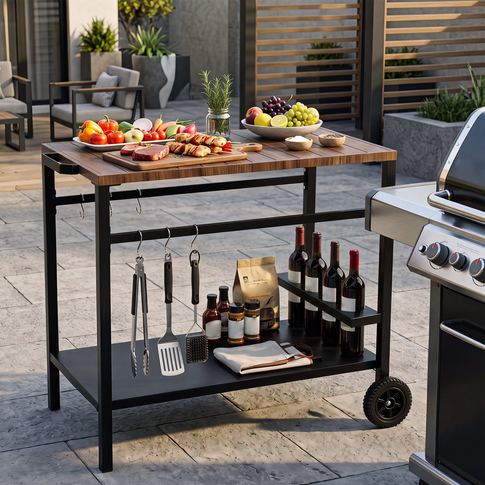 Outdoor grill cart with a stainless top, spice rack, and hooks for efficient prep and organization in patio settings.