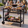 Outdoor grill cart with stainless top, spice rack, and hooks, ideal for organizing patio cooking and gatherings.