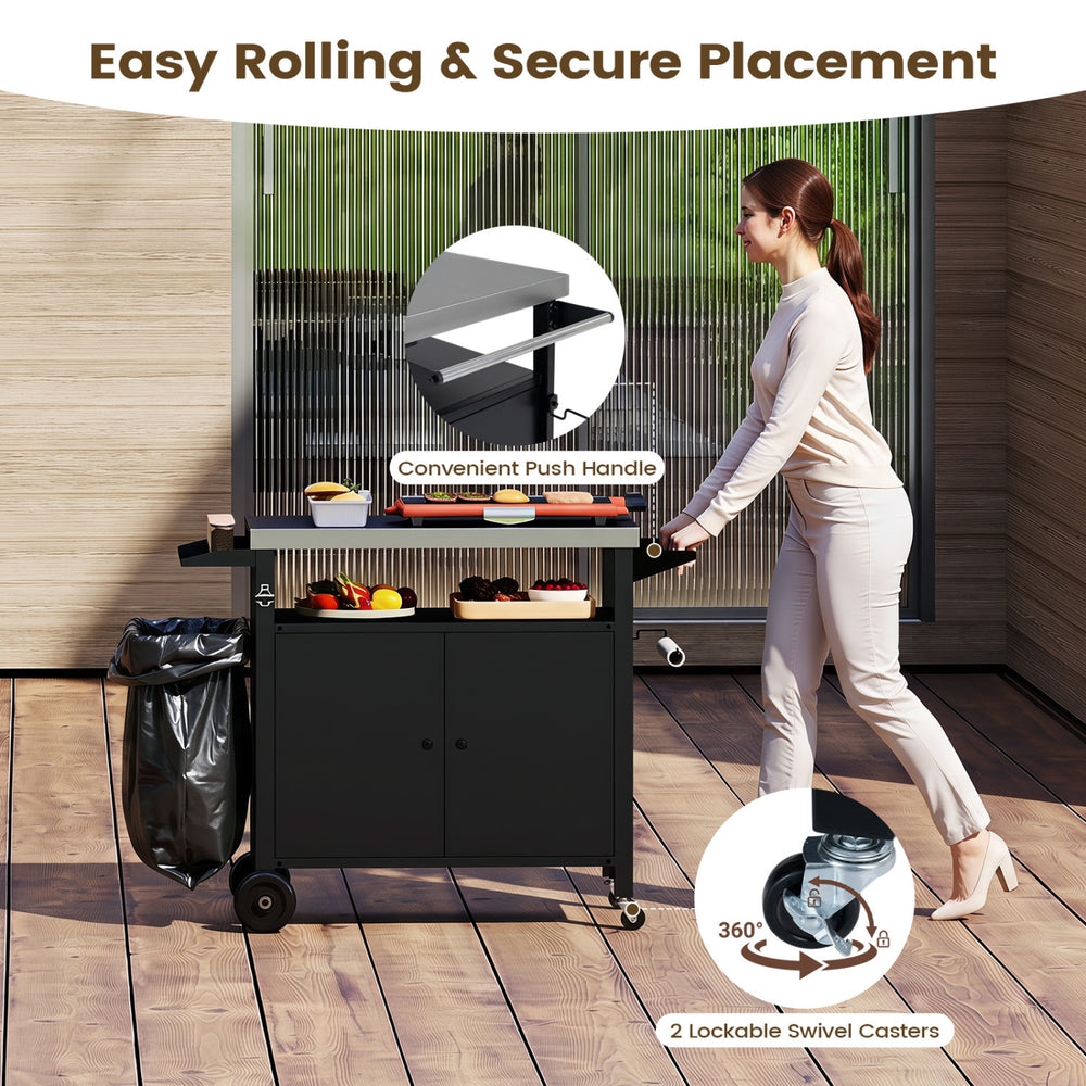 Outdoor grill cart with stainless steel top, featuring a spacious cabinet, push handle, and lockable swivel casters for mobility.