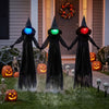 Three spooky outdoor Halloween witch decorations with LED lighted heads, perfect for creating a haunted yard atmosphere.