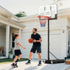 Portable adjustable outdoor basketball hoop system, 3.3-7 ft height, shatterproof backboard, ideal for kids' play.