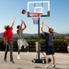 Kids playing basketball with a portable adjustable hoop system, featuring a shatterproof backboard and built-in wheels.