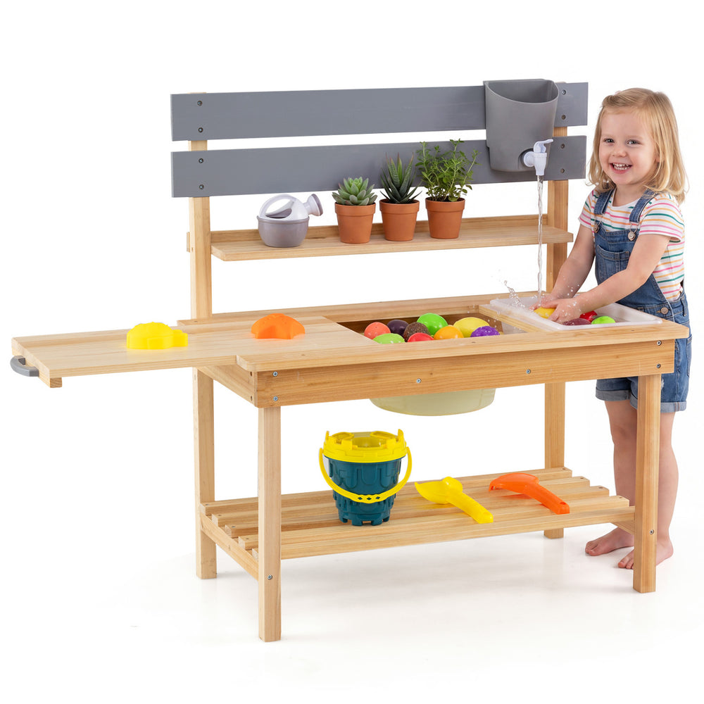 Wooden outdoor mud kitchen for kids with sink, faucet, and extended tabletop for imaginative play and organization.