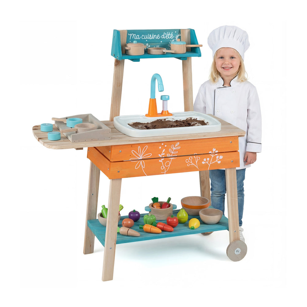 Wooden outdoor kids play kitchen set in orange with removable sink, featuring a child chef and colorful play food.